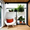 Small house interior with space-efficient furniture and organized storage, landscaped garden with vertical planting and functional layout