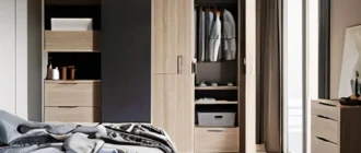 Organized small apartment interior with efficient storage solutions in bedroom, living room, and kitchen.